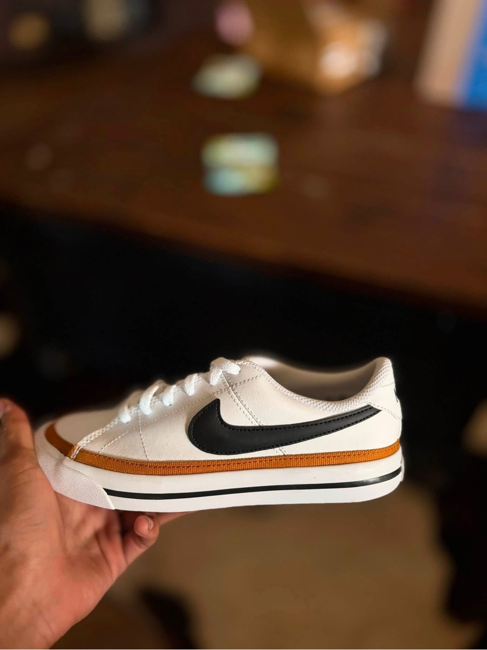4Y or 5.5W Nike Kids White Sneakers with Black Swoosh and Gold Accent
